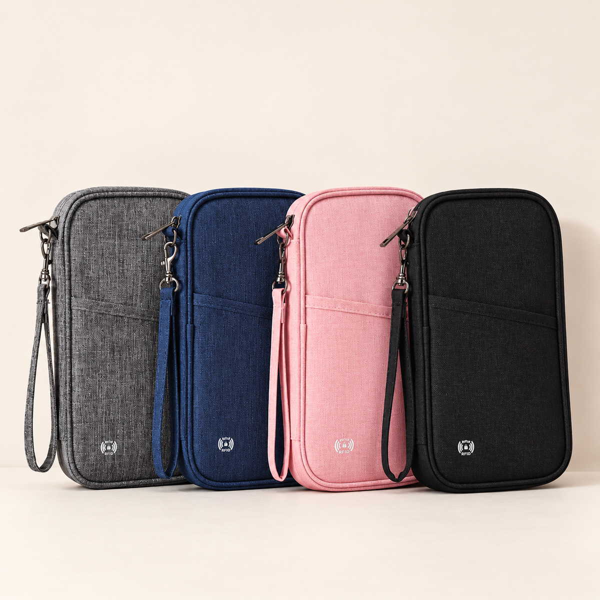 Travel document organisers in grey, dark blue, pink and black
